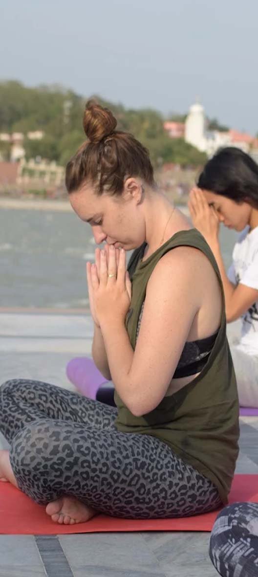 Students practising yoga during the 100 hour yoga teacher training at Avatar Yoga School in Rishikesh