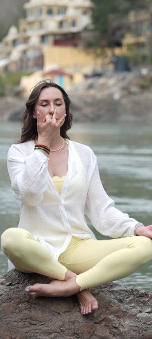 Students practising Kundalini yoga during the 200 hour teacher training at Avatar Yoga School in Rishikesh