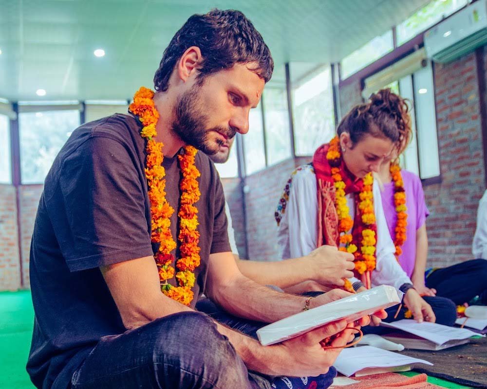 Teacher guiding a student through a gentle Kundalini breathing practice
