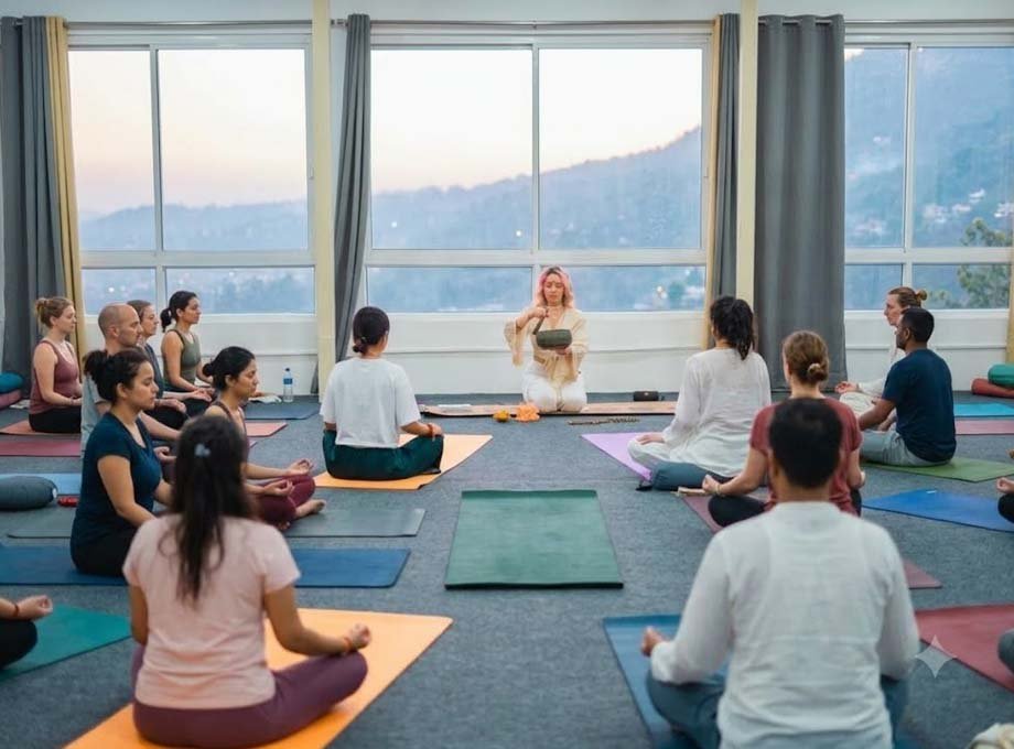 Sound bath session with singing bowls during sound healing training in Rishikesh