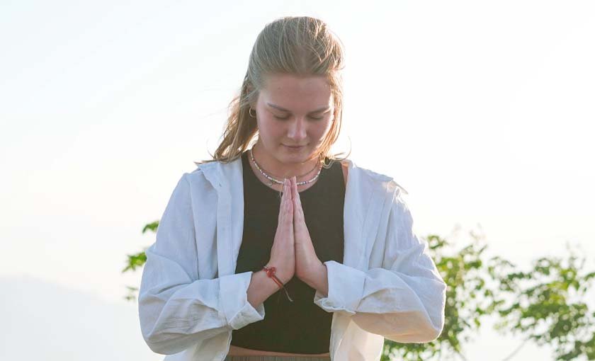 Students using bolsters and blocks in a Yin yoga class in Rishikesh