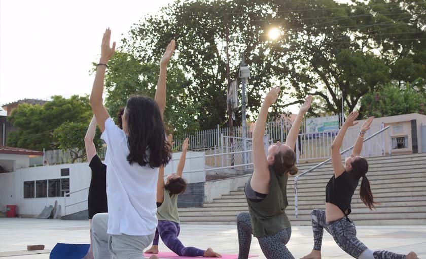 Yoga retreat session by the Ganga in Rishikesh